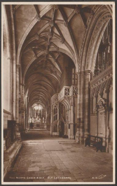 Sepia real photographic postcard showing a view of the north choir aisle of Ely Cathedral at Ely in Cambridgeshire.

Published by Walter Scott, Bradford, No K16, c.1930.

Postally unused.

Very good condition, with very slight to slight corner bumps and light album marks.