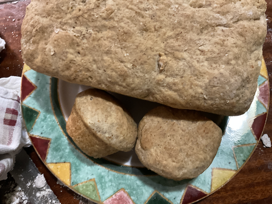 Plate with Bread loaf with a pair of bread rolls next to it