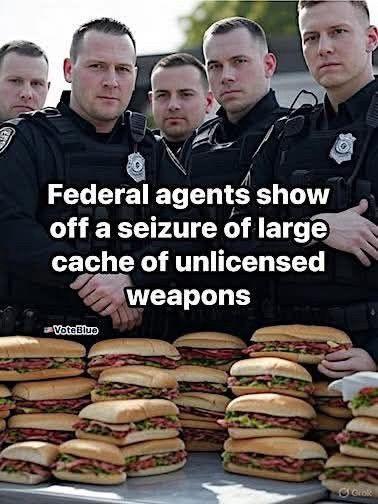 Picture of law enforcement officers with a large pile of sandwiches.

Caption:
Federal agents show
off a seizure of large 
cache of unlicensed 
weapons