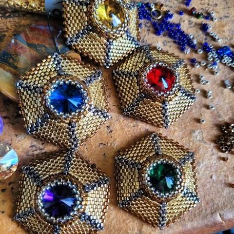 Six beaded hexagons inlaid with 14mm chatons of various colors.