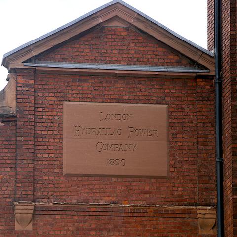 Large Terracotta plaque reading London Hydraulic Power Company 1890, on Wapping Wall.
