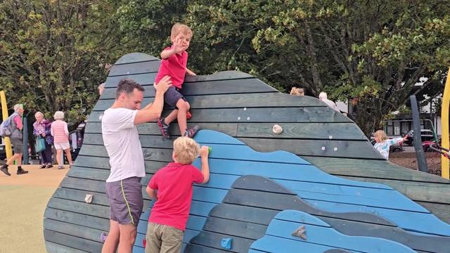 Children playing on the new climbing wall at Mumbles' seafront play area