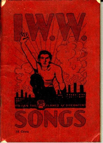 Cover of the IWW Little Red Song Book with image of a young man, raised fist, with industrial background and rays of sunshine.