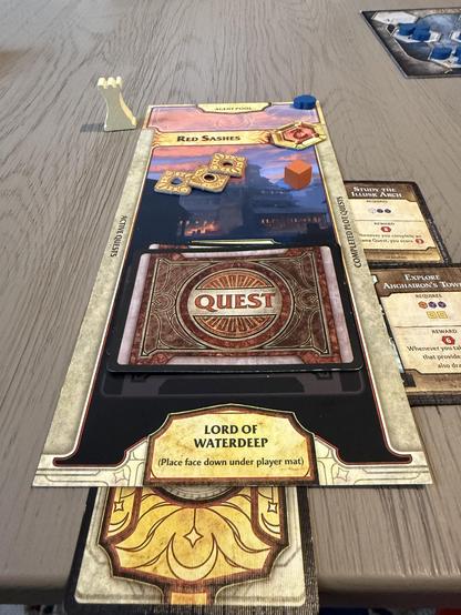 Lords of Waterdeep player board. Sexy Red Sashes. Couple of completed plot quests on the right. A little money and cubes on the board. First player marker top left.