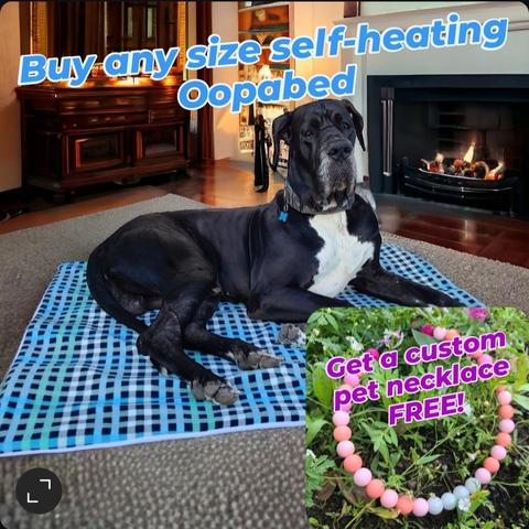 Black with white Great Dane laying in the living room on his blue checker Self-heating Oopabed.

Buy any size self-heating Oppabed and get a custom pet necklace FREE!