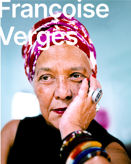 There is a portrait of Françoise Vergès, she is sitting in a colourful head scarf on the blue background. Her hand is tucked below her head. She is wearing colourful bracelets on her arm. The name of the speaker Françoise Vergès is written in white letters.