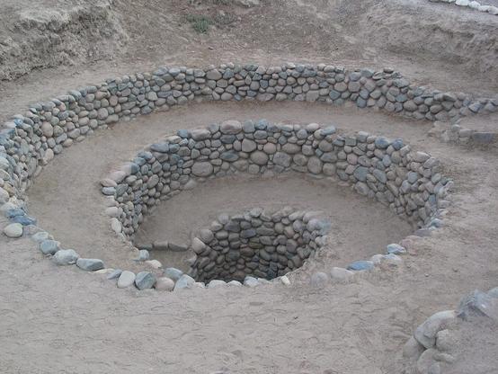 The spiral-shaped entrance to a puquios chimney, part of a pre-Columbian irrigation system in the Nazca region of Peru.