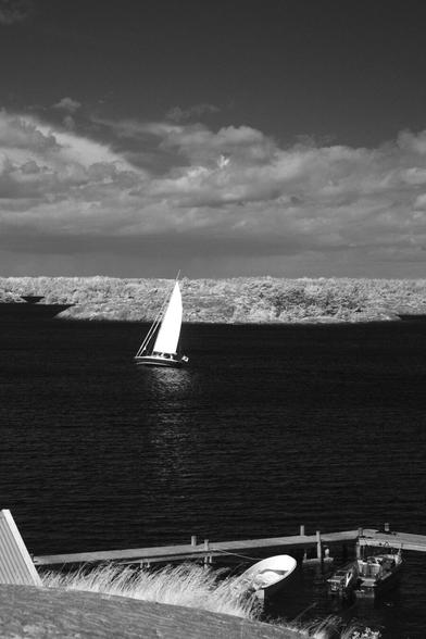 Black and white, infrared photography: a sailboat off the Sandhamn shore