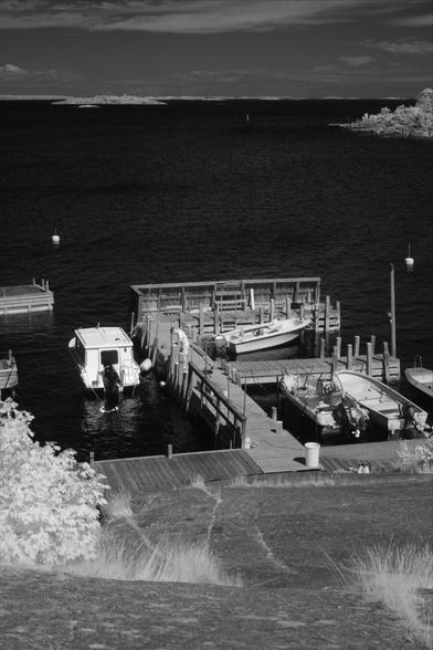 Black and white, infrared photography: boats off the Sandhamn shore looking out to Telegrafholmen