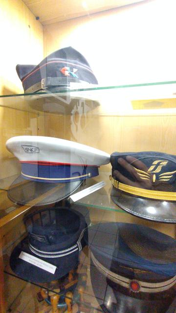 conductor's hats on display from Poland, the UK,  France and Italy