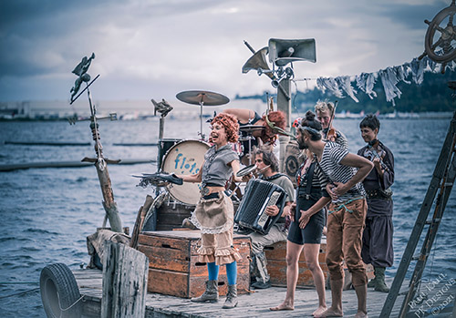 Performers of the Flotsam River Circus aboard their raft. (Photo from their website.)