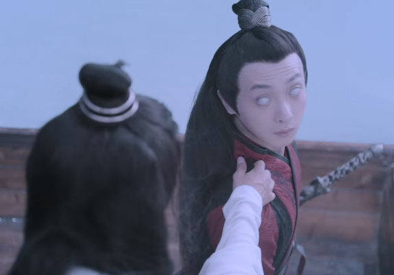 Wei Wuxian rides his sword down to a hover behind Wen Ning where he stands in a boat on Biling Lake and reaches out with his right hand to grab Wen Ning's shoulder. Wen Ning turns around when Wuxian's hand makes contact, revealing that his eyes have turned completely white.