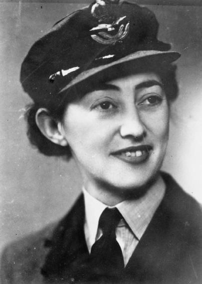 Yvonne Cormeau in Women's Auxiliary Air Force uniform. She is a white woman with dark hair.