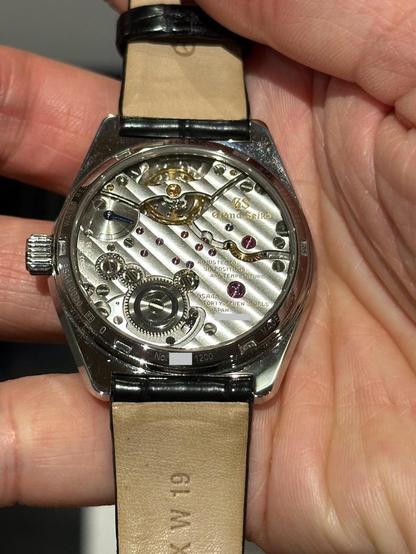 A close look at the modern 9SA4 movement through the exhibition case.