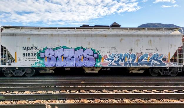 Train car with graffiti rolling through Kamloops BC Canada