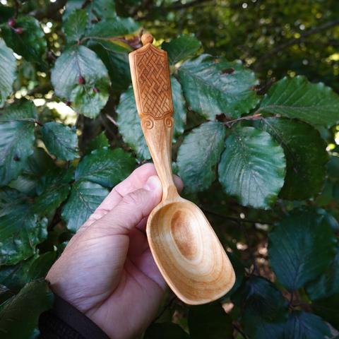 Wooden spoon held in vertical position