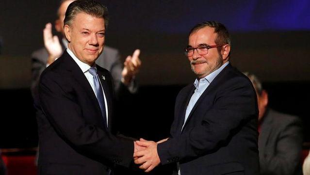 El president colombià, Juan Manuel Santos, i el líder de les FARC, Timochenko