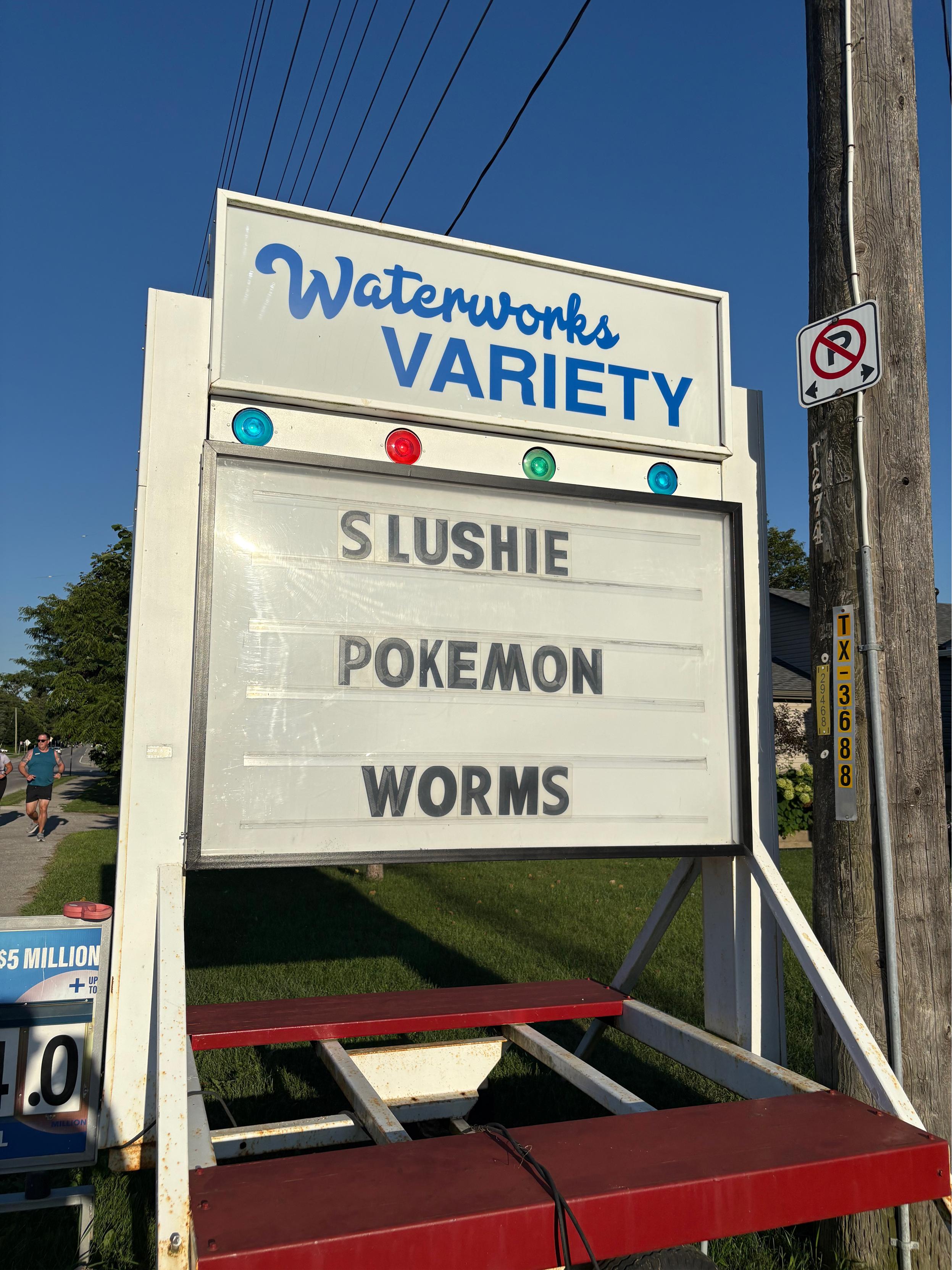 Sign in front of Waterworks Variety store: SLUSHIE POKEMON  WORMS