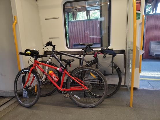 Two bikes in a subway carriage.