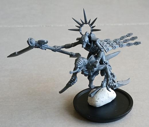 A sinister slender robot is mounted on an alien beast with great claws. The robot has a halo, and wields a sci-fi scythe.