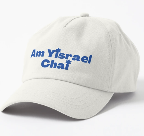 Am Yisrael Chai is shown in blue lettering on a white baseball hat.