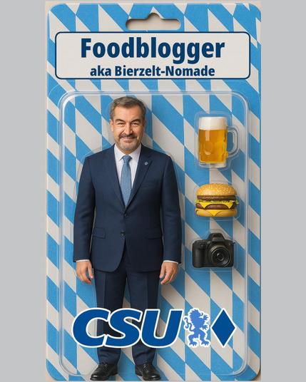 Das Bild zeigt eine stilisierte Verpackung, die an eine Action-Figur erinnert. Im Zentrum steht eine männliche Person in dunklem Businessanzug, weißem Hemd und blauer Krawatte. Der Hintergrund und die Verpackung sind in weiß-blauen Rautenmuster gestaltet, das an bayerische Tradition erinnert. Oberhalb der Figur steht groß „Foodblogger aka Bierzelt-Nomade“. Rechts von der Person sind drei Gegenstände abgebildet: ein großes Bierglas mit Schaum, ein Hamburger mit zwei Fleischscheiben und eine Kamera. Im unteren Bereich des Bildes befindet sich das Logo der CSU, inklusive Löwe. Die Gesamtgestaltung verbindet Elemente aus Politik, Essen und Social Media mit bayerischen Symbolen.