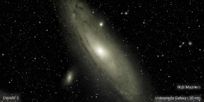 The Andromeda Galaxy - a spiral Galaxy, tilted at about 60 degrees top to the left. Near the top is a bright spot (M32) and below another galaxy, M110.