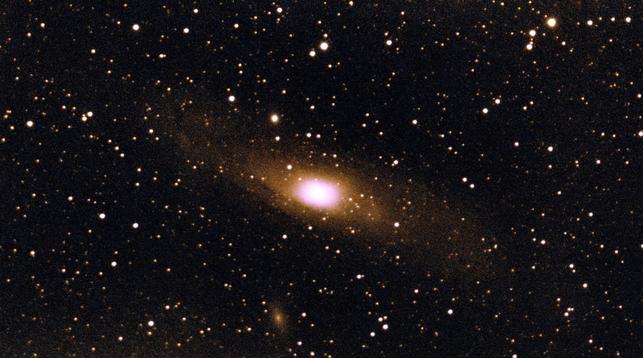 The Andromeda Galaxy, this time almost horizontal, with M110 barely visible below, and none of the rich detail of the other image.