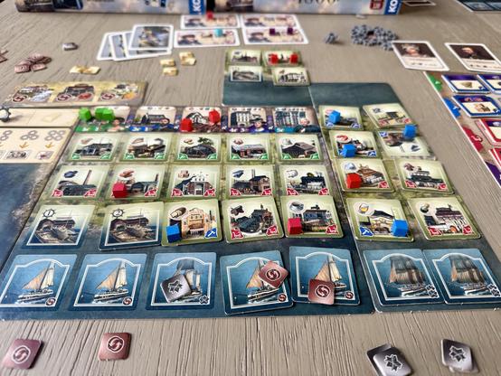 Endgame Anno 1800 board. Lots of production tiles and boats.
