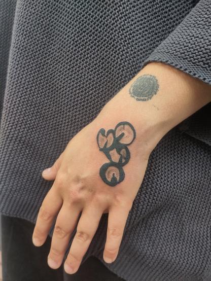 abstract tattoo on a hand