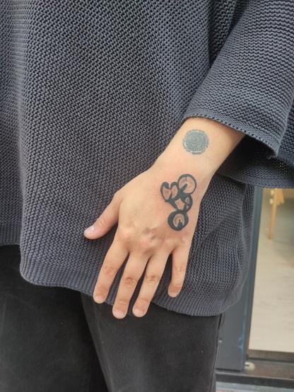 abstract tattoo on a hand