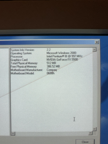 A second MadOnion.com System Info window shows the upgraded specs. The CPU is now an Intel Pentium III at 997 MHz, still paired with the GeForce FX 5500 and 512MB RAM. Free physical memory is listed as 386.52 MB. Motherboard info remains unchanged.