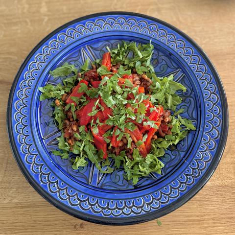 The tiger bean salad in a beautiful blue Tagine style bowl.
