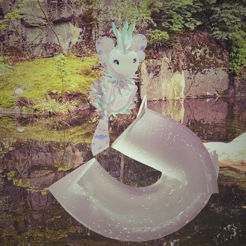 A white and blue icicle archetype dot hovering in the air over some water in front of moss, rocks, and trees. It has the tail chaos trait Estharian.