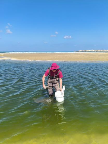 Sampling a black and odorous sediment, also, the waders leaked.