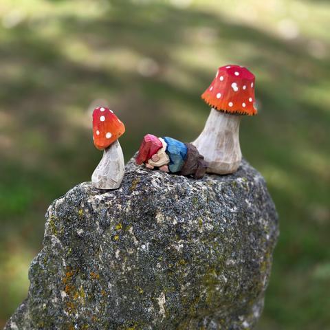A single gnome, sleeping on a peak.