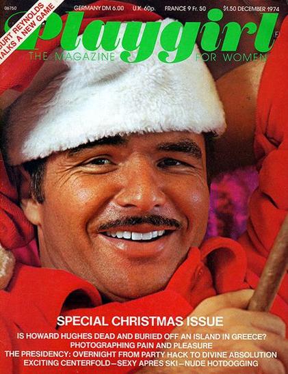 Portada de la revista Playgirl con un hombre sonriendo, vestido como Santa Claus, en un contexto navideño.