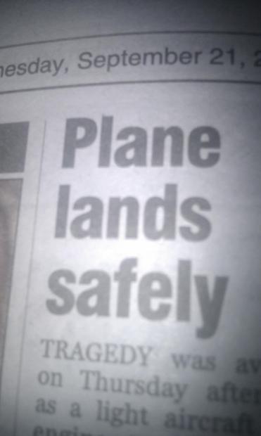 A headline from a newspaper.
It reads "Plane lands safely".