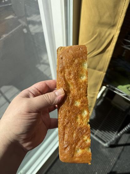 Bottom crust of the focaccia showing a golden brown almost uniform crust