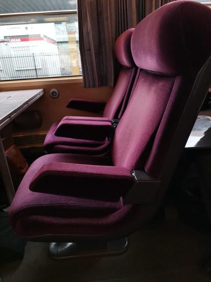 A first class seat. Notice the rounded angles and streamlined yet geometric shapes.