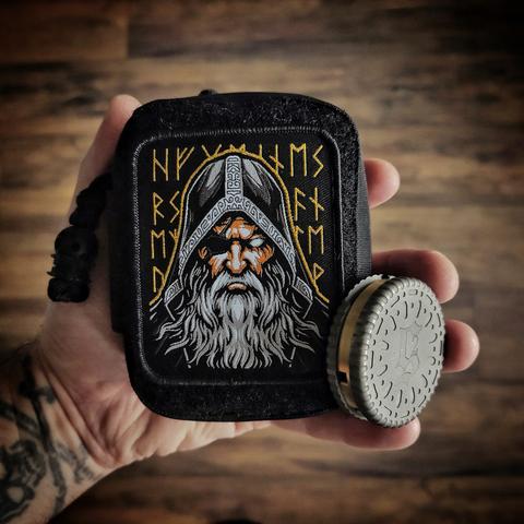 photograph of an EDC pouch displaying an Odin patch alongside a metal Death Cookie