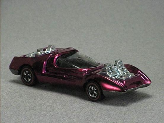 Released in 1970, Spectraflame Magenta Mod Quad of 1970 Hot Wheels with Redline wheels. Notes: Has four exposed metal engines and a plastic canopy that opens. Packaging: 1970 Blister. Metal Body, Metal Base. Made in USA. Scarcity: 4/10