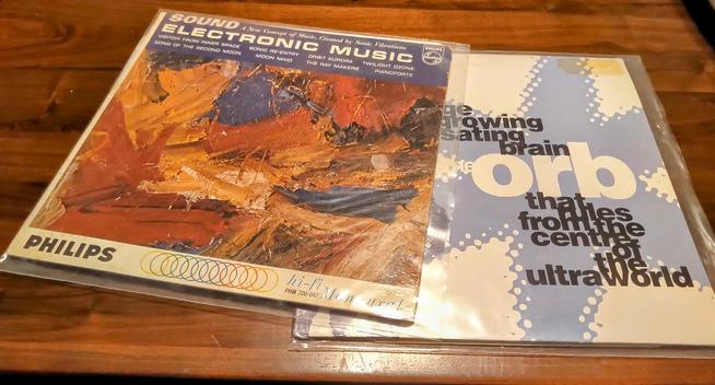 The two albums laying on the table as I'm listening to them in the living room sound system.