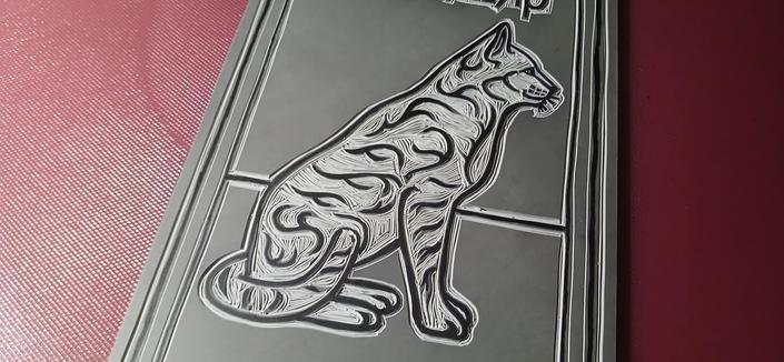 Image 3 of 3: A closeup of the cat design carved into the lino.