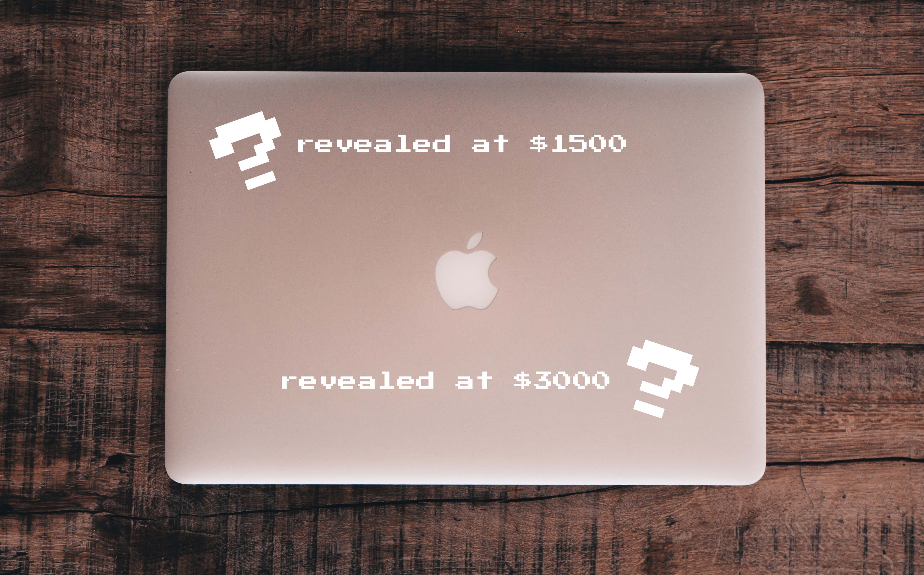 A laptop with two white questions marks where stickers could go in each corner. Text next to them says the stickers will be revealed at $1500 and $3000