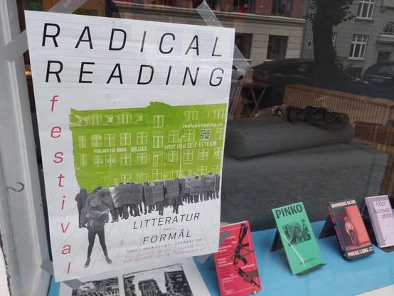 Poster of the Radical Reading Festival on the BCAB's window.