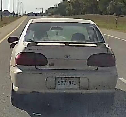 A still frame from dashcam video, showing the rear of the road-raging asshole's car and its Saskatchewan license plate, "527 MZJ".