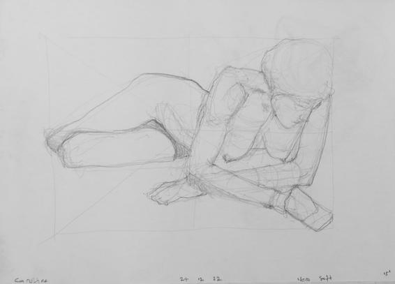 Drawing portrait of a female art model lying naked on the floor