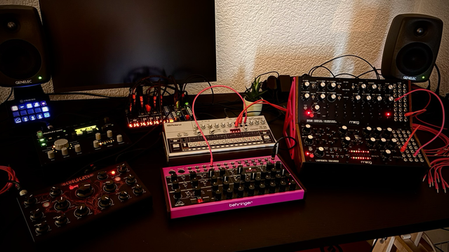 Behringer Edge, moog DFAM and Labyrinth, Roland TR-06, Erica Synths Echolocator, Electron Analog Heat MkII sitting on my studio desk, high contrast shot with visible LEDs and maybe a bit too much processing 🤭