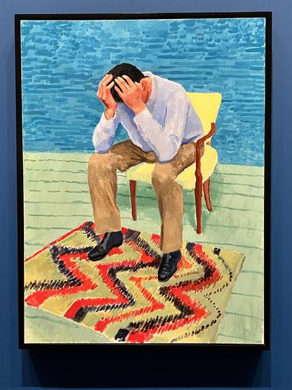 Ein Mann, den Kopf in die Hände gestützt